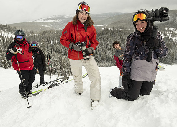 Journalism students pose with cameras at Lost Trail Powder Mountain.